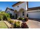 Inviting entryway with arched columns and lush landscaping at 9067 Arbors Edge Trl, Windermere, FL 34786