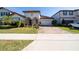 Stunning curb appeal with a welcoming porch and landscaped yard at 9067 Arbors Edge Trl, Windermere, FL 34786