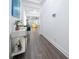 Clean hallway showcasing stylish console table and hardwood floors at 9067 Arbors Edge Trl, Windermere, FL 34786