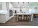 Bright kitchen with white cabinets, an island, and pendant lighting at 9067 Arbors Edge Trl, Windermere, FL 34786
