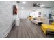 Open living space with a sofa, yellow accent chair, and ceiling fan at 9067 Arbors Edge Trl, Windermere, FL 34786