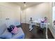 Home office with a white desk and comfortable seating area at 9067 Arbors Edge Trl, Windermere, FL 34786