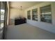 Screened-in patio with built-in outdoor kitchen and grill at 9067 Arbors Edge Trl, Windermere, FL 34786