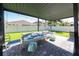 Covered patio with seating area, perfect for relaxing at 9067 Arbors Edge Trl, Windermere, FL 34786