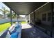 Covered patio with seating area and view of the backyard at 9067 Arbors Edge Trl, Windermere, FL 34786