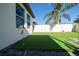 Artificial turf putting green beside the house at 9067 Arbors Edge Trl, Windermere, FL 34786