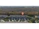 Aerial view of townhouses and surrounding landscape at 9434 Myrtle Creek Ln # 914, Orlando, FL 32832