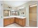 Bathroom boasting dual sinks, lots of counter space and a large mirror at 9786 Lake District Ln, Orlando, FL 32832