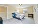 Nicely decorated bedroom with a window view, and comfortable blue bedding at 9786 Lake District Ln, Orlando, FL 32832