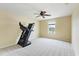 Spare bedroom with a ceiling fan, a window, and space for a treadmill at 9786 Lake District Ln, Orlando, FL 32832