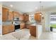 Stylish kitchen with stainless steel appliances, custom cabinets, and a breakfast bar at 9786 Lake District Ln, Orlando, FL 32832