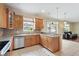 Gourmet kitchen with granite countertops, stainless steel appliances, and custom wood cabinetry at 9786 Lake District Ln, Orlando, FL 32832