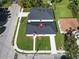 An aerial view showcases the property's new roof, manicured lawn, and proximity to other homes at 1022 Mack Ave, Orlando, FL 32805