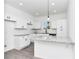 Open and airy kitchen features modern appliances, granite counters, and bar seating at 1022 Mack Ave, Orlando, FL 32805