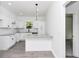 Stylish kitchen boasts granite countertops, stainless steel appliances, and island seating at 1022 Mack Ave, Orlando, FL 32805