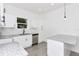 Bright kitchen features granite countertops, stainless steel appliances, and ample cabinet space at 1022 Mack Ave, Orlando, FL 32805