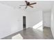 Sunlit living room featuring tiled floors, neutral paint colors and modern fixtures at 1022 Mack Ave, Orlando, FL 32805
