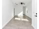 Sunlit living room featuring tiled floors, neutral paint colors and modern fixtures at 1022 Mack Ave, Orlando, FL 32805