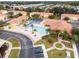 Aerial view of community pool and surrounding buildings at 1118 Park Ridge Cir, Kissimmee, FL 34746