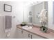 Vanity with sink, mirror, and white cabinets at 1118 Park Ridge Cir, Kissimmee, FL 34746