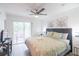 King-size bed, private balcony, and modern decor at 1118 Park Ridge Cir, Kissimmee, FL 34746