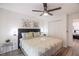 King-size bed, ceiling fan, and spacious closet at 1118 Park Ridge Cir, Kissimmee, FL 34746