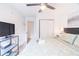 King-size bed, TV, and private closet at 1118 Park Ridge Cir, Kissimmee, FL 34746