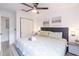 King bed, ceiling fan, and spacious closet at 1118 Park Ridge Cir, Kissimmee, FL 34746
