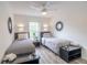 Twin beds, large window, and modern decor at 1118 Park Ridge Cir, Kissimmee, FL 34746