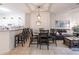 Open concept dining area with a large table, seating for six, and a view into the living room at 1118 Park Ridge Cir, Kissimmee, FL 34746