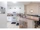 Bright kitchen with white cabinets, granite countertops, and stainless steel appliances at 1118 Park Ridge Cir, Kissimmee, FL 34746