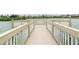 Lakefront deck with seating areas and railings at 1118 Park Ridge Cir, Kissimmee, FL 34746
