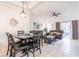 Spacious living room with dark leather seating, and access to a patio at 1118 Park Ridge Cir, Kissimmee, FL 34746