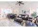 Living room features a large sectional sofa, coffee table, and ceiling fan at 1118 Park Ridge Cir, Kissimmee, FL 34746