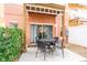 Private patio with table and chairs, perfect for outdoor dining at 1118 Park Ridge Cir, Kissimmee, FL 34746