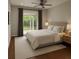 Bright bedroom with a sliding glass door with access to the outdoor views and hardwood floors at 12212 Holly Jane Ct, Orlando, FL 32824