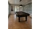 Well-lit game room with a pool table, creating an inviting space for entertainment at 12212 Holly Jane Ct, Orlando, FL 32824