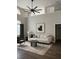 Stylish living room featuring high ceilings, modern furnishings, and an abundance of natural light at 12212 Holly Jane Ct, Orlando, FL 32824