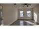 Bright bedroom with wood-style floors, ceiling fan, and natural light from the double windows at 1315 Congo Dr, Kissimmee, FL 34759