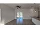 Living room area featuring ceiling fan, recessed lighting, granite countertop and sliding glass doors at 1315 Congo Dr, Kissimmee, FL 34759