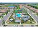 Aerial view of community pool, playground, and homes at 1320 Moss Creek Ln, Davenport, FL 33836