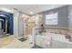 Elegant bathroom with soaking tub and walk-in shower at 1320 Moss Creek Ln, Davenport, FL 33836