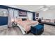 Large bedroom with a king-size bed and sitting area at 1320 Moss Creek Ln, Davenport, FL 33836