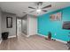 Bright bedroom with wood floors, ceiling fan, and large closet at 1320 Moss Creek Ln, Davenport, FL 33836