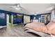 Bright bedroom with a comfortable bed and built in entertainment center at 1320 Moss Creek Ln, Davenport, FL 33836
