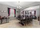 Spacious dining room with coffee and wine bar at 1320 Moss Creek Ln, Davenport, FL 33836