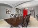 Formal dining room with large table and access to kitchen at 1320 Moss Creek Ln, Davenport, FL 33836