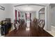 Formal dining room with a large wood table and wine bar at 1320 Moss Creek Ln, Davenport, FL 33836
