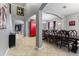 Formal dining room with large table, red cabinet, and high ceilings at 1320 Moss Creek Ln, Davenport, FL 33836