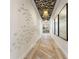 Modern clubhouse hallway with unique wall art and flooring at 1320 Moss Creek Ln, Davenport, FL 33836